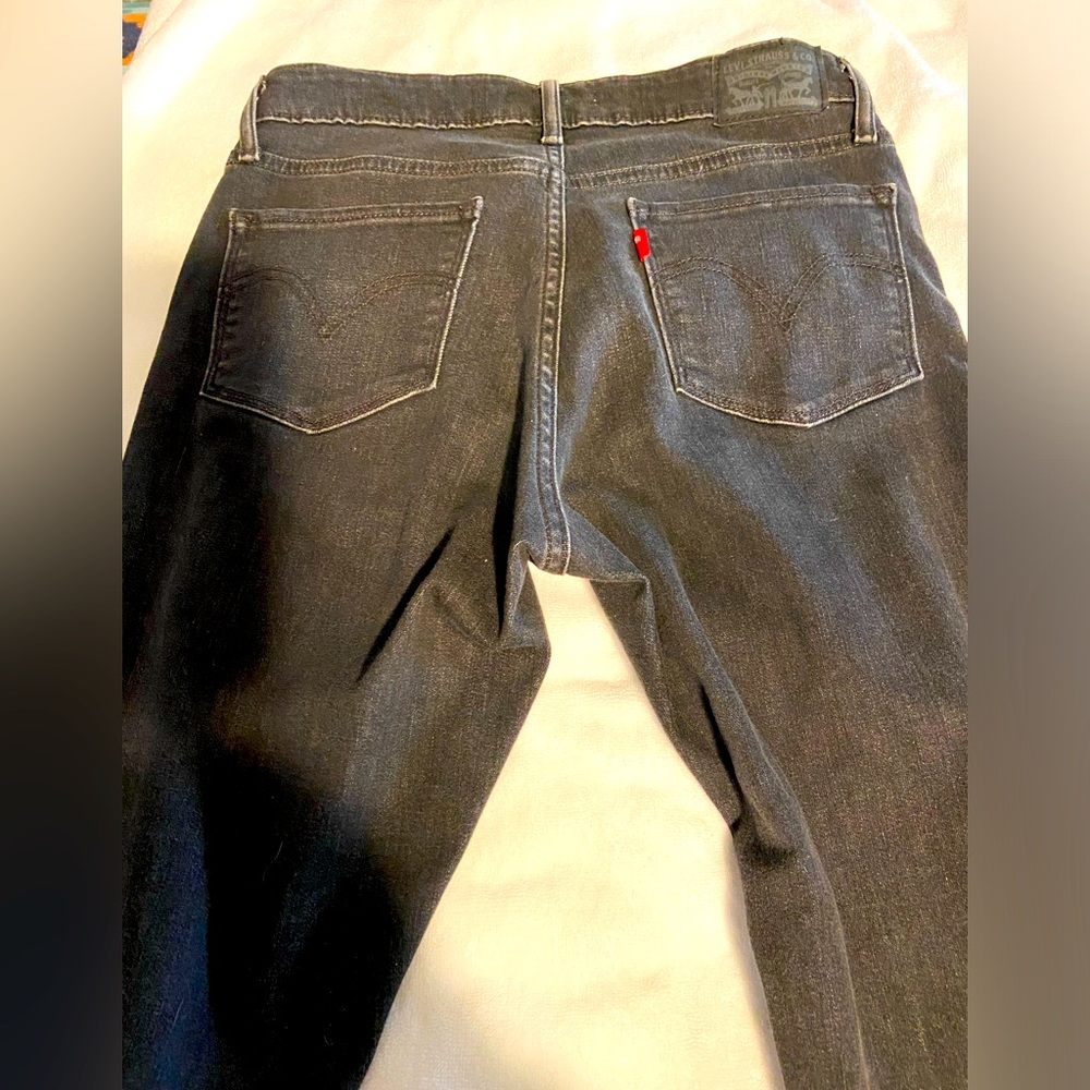 Womens classic mid rise skinny jeans in black size 8.